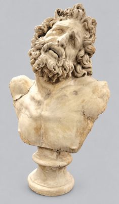 an image of a bust of a man with a beard on a pedestal