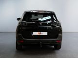 a picture of a small black car parked in a room