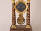 a clock that is sitting on top of a table