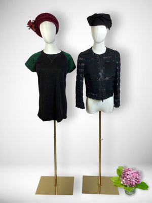pair of mannequins in black and green with flowers