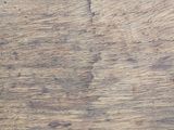 a close up of a piece of wood on a table