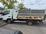 a white truck that is parked in a parking lot