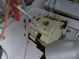 a sewing machine that is sitting on a boat