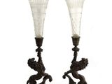 pair of antique glass vases on wooden stand on white background