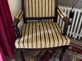 a chair that is sitting in front of a radiator
