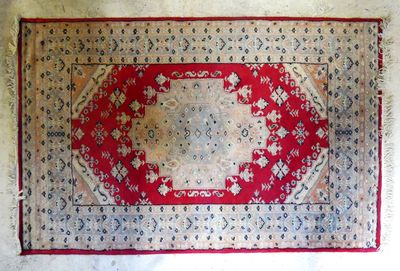 an image of a red and white rug on a white surface