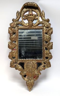a mirror that is hanging on the wall in the room