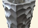 a white vase that is sitting on a table