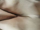 a close up view of a person ' s stomach with a ring on it