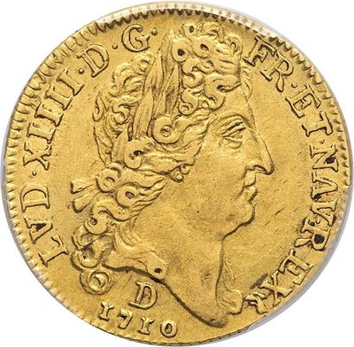 a gold coin with a woman ' s head and a crown on it