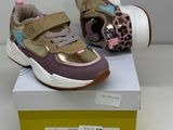 a pair of shoes that are on top of a box