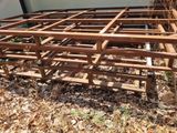 a wooden structure in the middle of the ground
