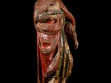 an image of a statue of a woman in a red dress