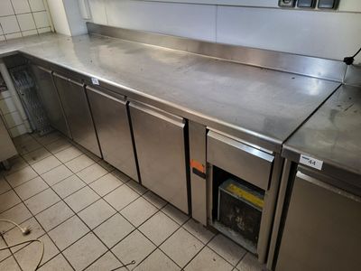 stainless steel counter tops in a commercial kitchen with tile flooring