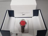 a box with a watch inside of it on a table