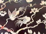 a picture of a decorative table with birds and flowers on it