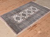 a rug on the floor with the word baa written on it