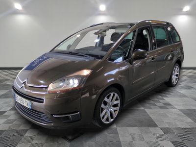 the brown van is parked on a checkered floor in the garage