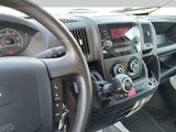 dashboard of a truck with a steering wheel and dashboard controls