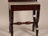 a small table with a mirror on top of it