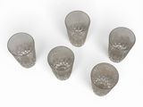 six glass cups sitting on top of each other on a white surface