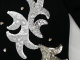 a picture of a black sweater with silver sequins on it