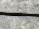 a sword that is laying on top of a table