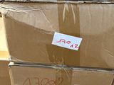 several cardboard boxes are stacked on top of each other with stickers on them