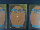 three decks of the magic the gathering deck are on display