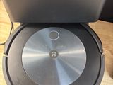 an image of a robotic vacuum cleaner sitting on top of a wooden table