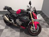 a picture of a red and black motorcycle parked on a checkered floor