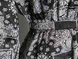 black and white paisley print dress with long sleeves and belt