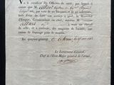 an old document with writing on it sitting on a table