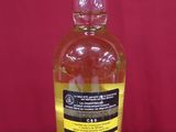 an image of a bottle of liquor on a red background