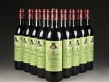 six bottles of red wine are lined up in a row