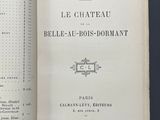 an open book with french text on a black background