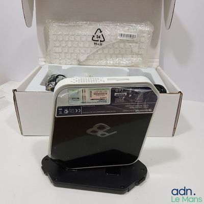 a box with a computer inside of it on a table