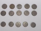 a close up of a bunch of coins on a white surface