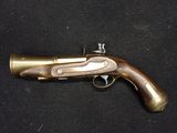 a close up of a gun that is on a black surface