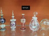 a lot of glass bottles that are sitting on a table