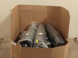 a cardboard box filled with rolls of black plastic
