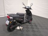 a scooter that is parked in a garage
