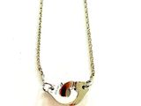 Collier en argent massif représentant un oiseau, avec des yeux en émail rouge et blanc