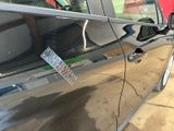 a sticker on the door of a car that has a sticker attached to it