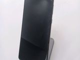 a cell phone that is sitting on top of a stand