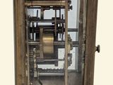 a clock that is sitting inside of a glass case