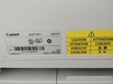 a close up of a printer with a yellow sticker on it