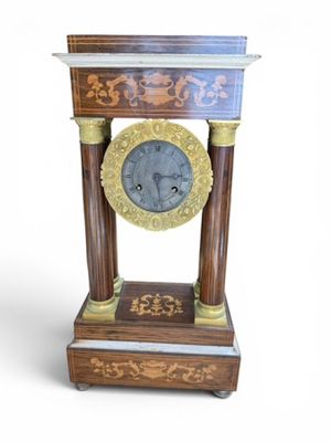 a clock that is sitting on top of a table