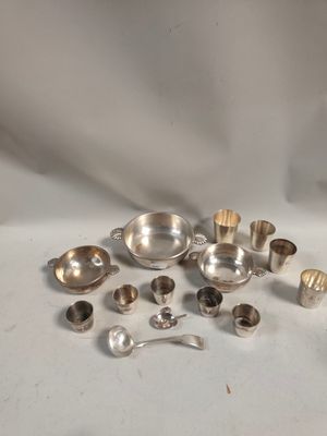 a lot of silver spoons and spoons on a table