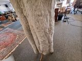 an image of a living room with a couch and a rug